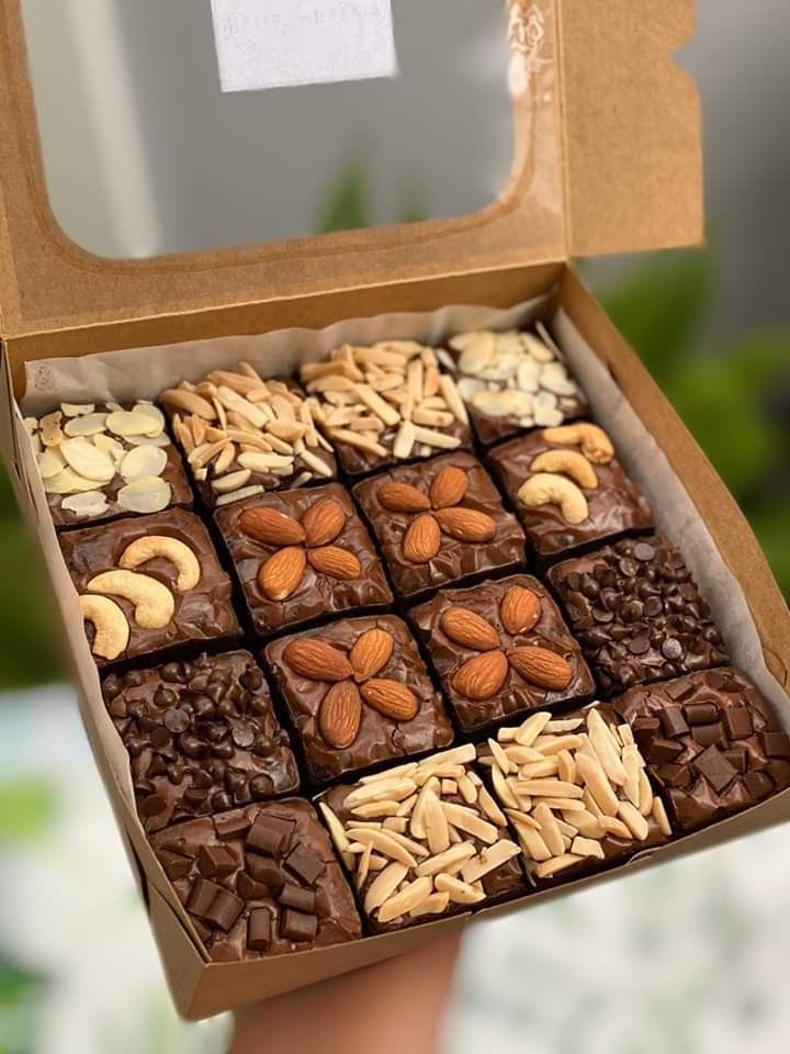 a box filled with assorted chocolates and nuts