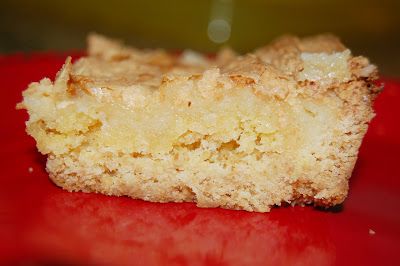 a close up of a piece of cake on a red plate with a blurry background