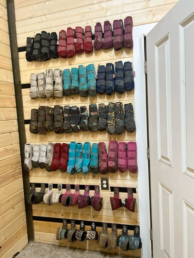 there are many pairs of shoes hanging on the wall