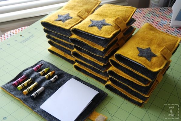 a stack of yellow and black notebooks sitting on top of a table