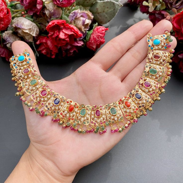 Featuring a navrattan necklace with chandbali earrings in 22ct gold. The necklace weighs 40.36 GMs including 4.83 GMs of hanging beads. The earrings 19.37 GMs including 2.13 GMs of hanging beads Price Breakup Summary Component Rupees % of Total 22k Gold 252,491 74.9% Stones & Beads 29,232 8.7% Making Charges 45,448 13.5% Taxes (GST) 9,815 3.0% Total 336,987 100.0% View Detailed Price Breakup 22k Gold Jewelry Necklaces, 22k Gold Jewelry, Hanging Beads, Chandbali Earrings, Pearl Necklace Set, Gold Jewelry Necklace, Emerald Necklace, Fancy Jewellery, Gold Bangle Bracelet