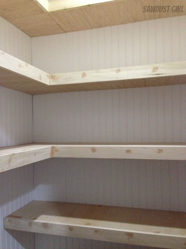 empty shelves in the corner of a room