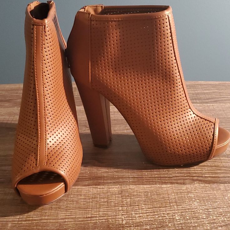 Mark & Maddux Peep Toe Bootie In Cognac, Size 8, (5 Inch Heel). Faux Leather, Brand New, Never Worn. Brown Faux Leather Heels For Spring, Spring Brown Faux Leather Heels, Brown Faux Leather Ankle Boot Heels, Spring Faux Leather Ankle Boot Heels, Chic Brown Faux Leather Booties, Brown Open Toe Heels For Fall, Brown Closed Toe Party Booties, Brown Closed Toe Booties For Party, Brown High Heel Booties For Party