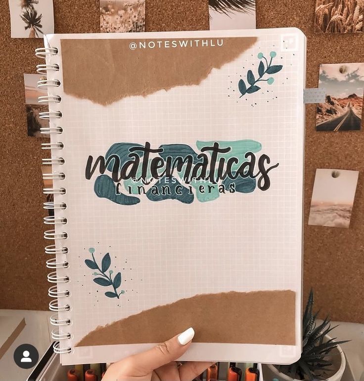 someone holding up a notebook with the words watermaticas written in cursive writing