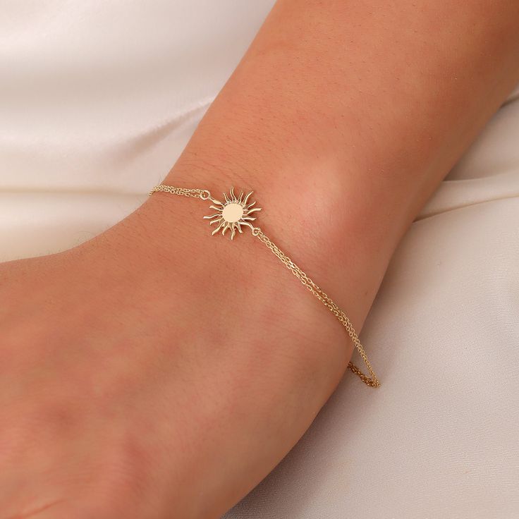 Tiny Sun Bracelet, 14K Real Gold Celestial Bracelet, Dainty Custom Sun Bracelet, Minimalist 14K Gold Sun Bracelet, Summer Jewelry, Gift For Her, Anniversary Bracelet, Birthday Gift, Christmas Gift, Solid Gold Bracelet, Minimalist Gold Bracelet, Wedding Bracelet, Valentine's Day Gift "Material: SOLİD GOLD (No Gold Filled Or No Gold Plated)" "KARAT: 14K (585) "Bracelet Length: 14,5 MM "Bracelet Width: 11,7 MM "Available Gold Color: (Yellow Gold, White Gold, Rose Gold) "The certificate will be sent with the product. *Sun Earrings Meaning: Ancient civilizations represented vitality and fertility with the sun figure. Gold, with its planetary essence, was seen as a chemical symbol signifying the completion of a great work. It also symbolizes leadership, strength and determination. ORDER PROCESS Celestial Gold Bracelet, Anniversary Bracelet, Bracelet Meaning, Celestial Bracelet, Sun Bracelet, Bracelet Summer, Bracelets With Meaning, Solid Gold Bracelet, Moon Bracelet