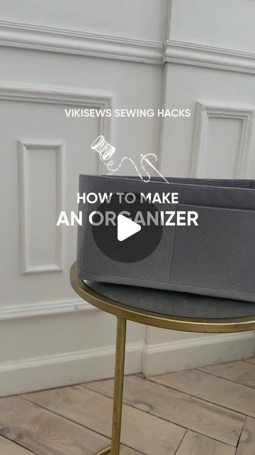 an organizer sitting on top of a table next to a wall with the words how to make an organizer