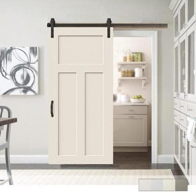 an open door leading to a kitchen with white cabinets and drawers on the wall, in front of a dining room table