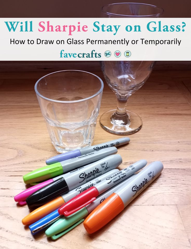 several pens are sitting on a table next to a glass with water in it and the caption will sharpie stay on glass? how to draw on glass permanently or temporary