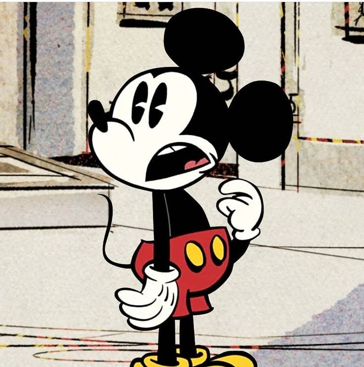 a cartoon mickey mouse is standing in front of a building and has his mouth open