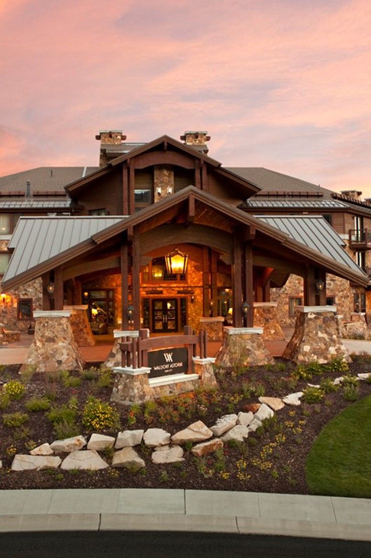 a large house with stone and wood accents