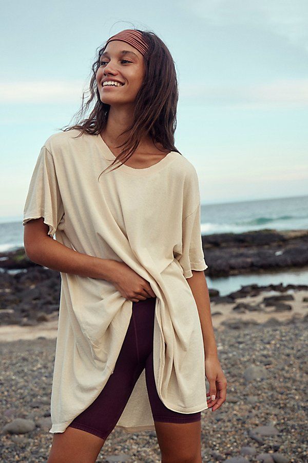 The perfect pre- and post-workout layer, this so sporty tee is featured in an oversized silhouette and asymmetrical hemline with a classic crew neckline, short-sleeves, and raw seams for a lived-in look. * Oversized * Relaxed fit * Crew neckline | Leg Day Tee by FP Movement at Free People, Muted Beige, S Summer Oversized Activewear For Loungewear, Effortless Oversized T-shirt For Layering, Relaxed Summer T-shirt For Layering, Relaxed Summer Layering T-shirt, Summer Scoop Neck Athleisure T-shirt, Oversized Crew Neck Workout Tops, Oversized Crew Neck Activewear For Summer, Oversized Athleisure Tops For Layering, Relaxed Fit Short Sleeve Activewear