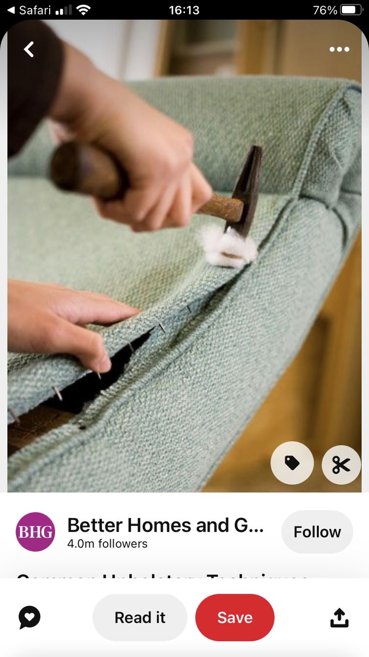 someone is using a pair of scissors to cut fabric off the back of a chair