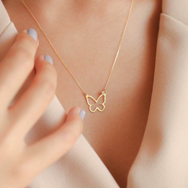 When a butterfly necklace is worn, a hurricane begins on the other side of the globe. Choose your own day and give your present in your own unique style. 14k solid gold handcrafted pieces 100% ethical sourced jewelry Material: 14k Solid Gold Diamond Quality:Carat Weight: 0.01 ctwColor: F-GClarity: VS2Cut: Excellent Pendant Height: 12 mm / 0.47 in Pendant Width: 12 mm / 0.47 in Chain Style: Cable Chain Chain Length: 18 inch Diamond Butterfly Necklace, Gold Butterfly Necklace, Butterfly Necklace Gold, Simple Butterfly, Diamond Butterfly, Simple Diamonds, Diamond Necklaces, Necklace Shop, Gold Diamond Necklace