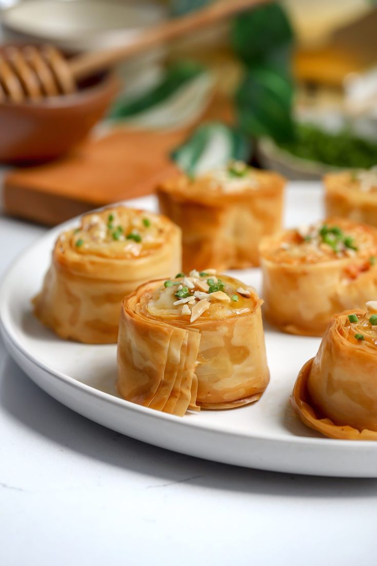 some food is sitting on a white plate and ready to be eaten with chopsticks