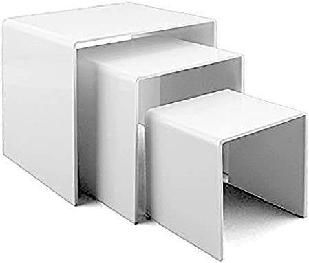 three pieces of white plastic furniture sitting on top of each other