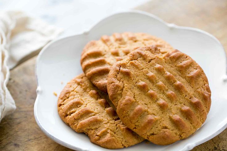 two peanut butter cookies on a white plate