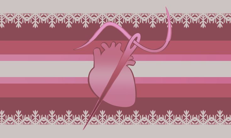 a pink and white striped wallpaper with an image of a heart in the center