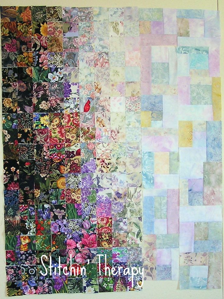 an abstract painting with many different colors and patterns on it's side, including squares