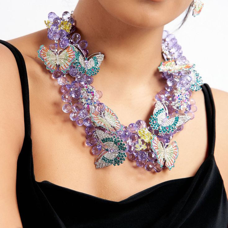 Hadassa Bib- Purple | Sassy Jones Sassy Jones, Butterfly Motif, Brooch Bouquets, Teardrop Beads, Butterfly Brooch, Resin Beads, Bib Necklace, Flower Brooch, Clear Crystal