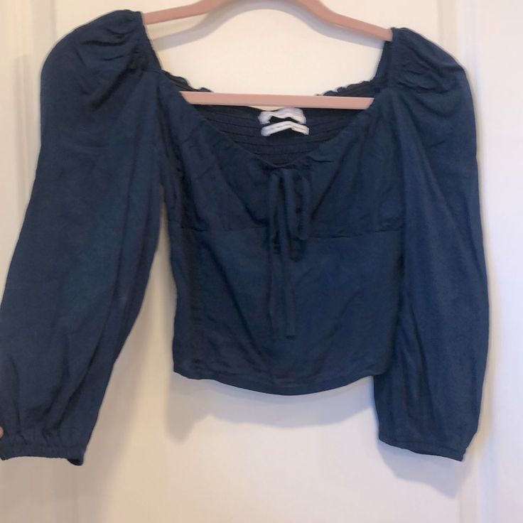 Urban Outfitters Lightweight Cropped Blouse In Navy Blue. Cute Peasant Looking Too With Elastic Winched Arms And An Elastic Back. Never Been Worn! Casual Tops With Blouson Sleeves For Brunch, Casual Blouson Sleeve Top For Brunch, Casual Tops With Blouson Sleeves For Day Out, Spring Blue Tops With Blouson Sleeves, Spring Blue Blouse With Blouson Sleeves, Blue Tops With Blouson Sleeves For Brunch, Chic Blue Puff Sleeve Long Top, Blue Blouson Sleeve Tops For Brunch, Fitted Blue Blouse With Blouson Sleeves