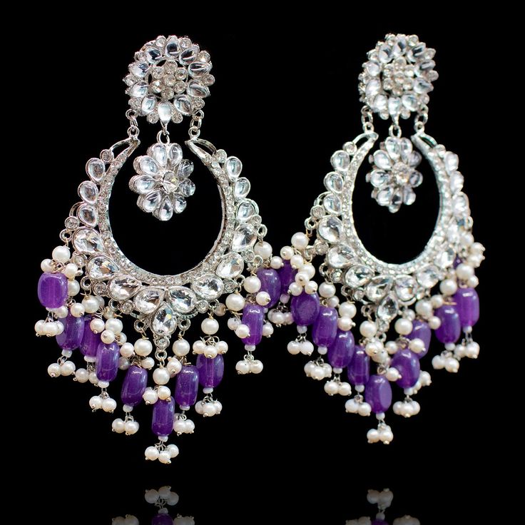 Jewelry that is timeless and never goes out of style! Look enchanting in our Ensha Earrings adorned with CZ stone and dangling beads. Approximate earrings length is 4.5". Gold-plated on high-quality brass as base metal. Ensha Earrings (Sea Green) & Ensha Earrings (Purple) are in-stock & ready-to-ship. The delivery time frame for Ensha Earrings (Teal), Ensha Earrings (Ruby) & Ensha Earrings (Yellow) is 4-6 weeks. For custom or urgent requests, please contact support@alacouture.com. *Please Note: Purple Sea, Earrings Purple, Faux Stone, Sea Green, Cz Stone, Purple Gold, Base Metal, Out Of Style, Mint Green