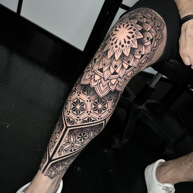 a man with a tattoo on his leg