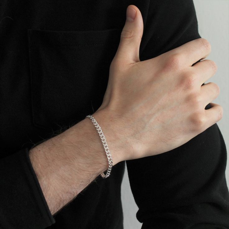 This bold bracelet features an intricate sterling silver curb chain that creates the perfect statement without being bulky. Designed to be unisex so men and non-binary individuals can also enjoy Kind Karma pieces, this bracelet is a wardrobe staple and you’ll realize why the moment you put it on! Details: Available in a variety of lengths Chain width: 4mm 925 sterling silver materials Hypoallergenic and nickel-free Tarnish and fade resistant Silver Curb Chain Bracelet, Birthstone Charm Necklace, Curb Chain Bracelet, Non Binary, Tote Bags Handmade, Ethical Jewelry, Silver Chain Bracelet, Zirconia Earrings, Cuban Link Chain