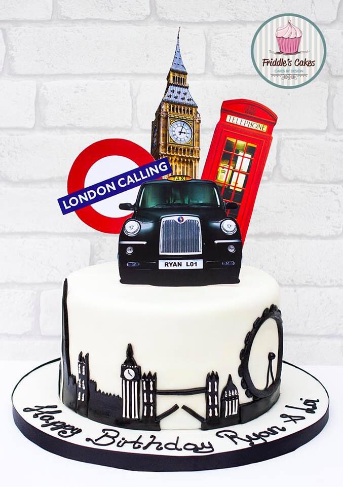 there is a cake that has been decorated to look like london and the big ben clock tower