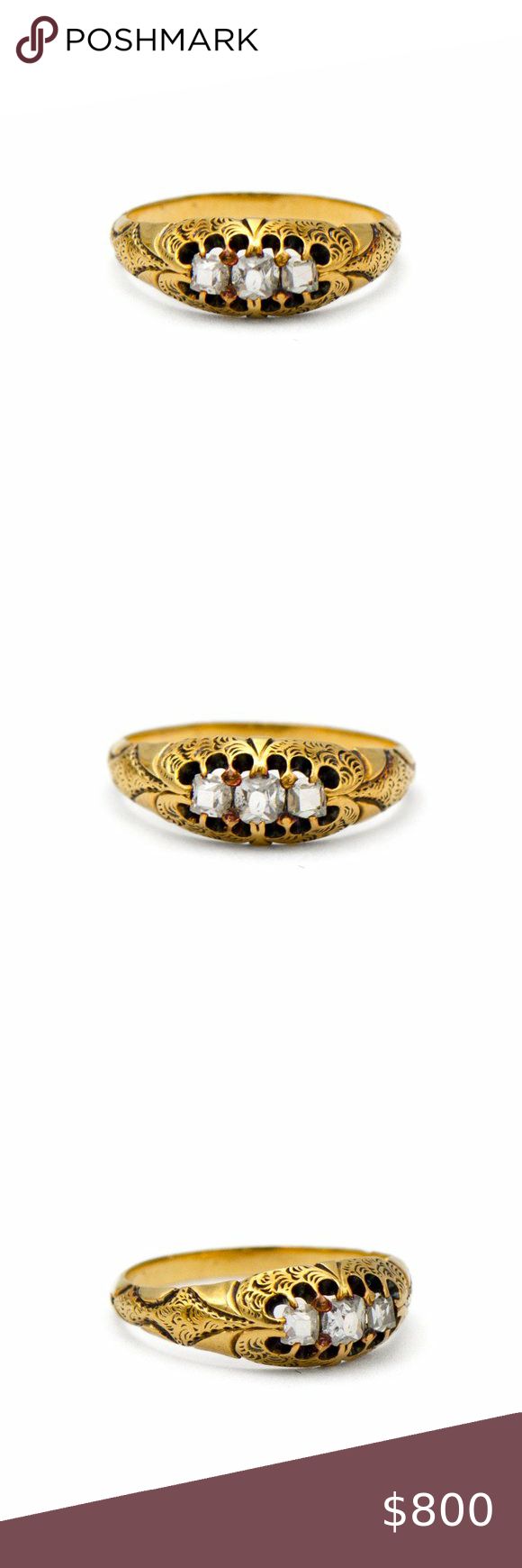 three different types of gold rings with white and black stones on them, one in the middle