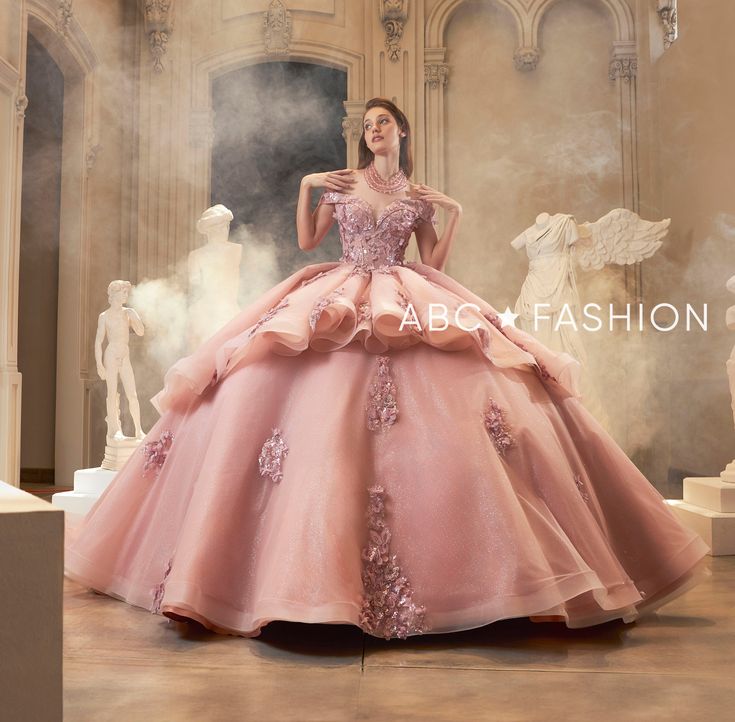 Look like a fairytale princess in this embroidered floral applique off the shoulder ball gown with A-line layered skirt by Ragazza Fashion EV60-660. This beautiful long off the shoulder corset dress features a sweetheart bodice adorned with floral appliques, open lace-up back, and a floor length A-line skirt with a sweep train. Off Shoulder Quinceanera Dress by Ragazza EV60-660 Designer: Swan Collection by Ragazza Fashion 2024 Style Number: EV60-660 Colors: Blush Pink Sizes: 3, 5, 7, 9, 11, 13, Quinceanera Dresses Pink And Gold, 16th Dresses, Off The Shoulder Corset Dress, 1500 Dresses, Xv Ideas, Fairytale Princess, Quinceanera Dresses Pink, Military Ball Dresses, Champagne Dress