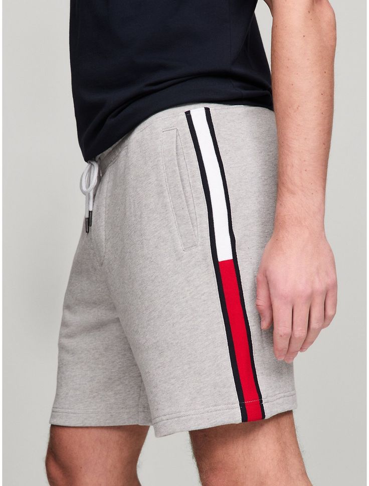 Tommy Hilfiger men's short. For days off or lounging around, reach for these cozy sweatshorts made from French terry cotton and printed with our signature flag stripe along the leg.  Material: 100% Cotton. Cotton Athleisure Shorts With Three Stripes Branding, Casual Cotton Athletic Shorts With Three Stripes, Cotton Athletic Shorts With Three Stripes, Cotton Shorts With Side Stripes, Casual Athletic Shorts With Side Stripes, Casual Cotton Shorts With Side Stripes, Casual Cotton Bottoms With Signature Stripes, Casual Shorts With Three Stripes, Tommy Hilfiger Sporty Shorts