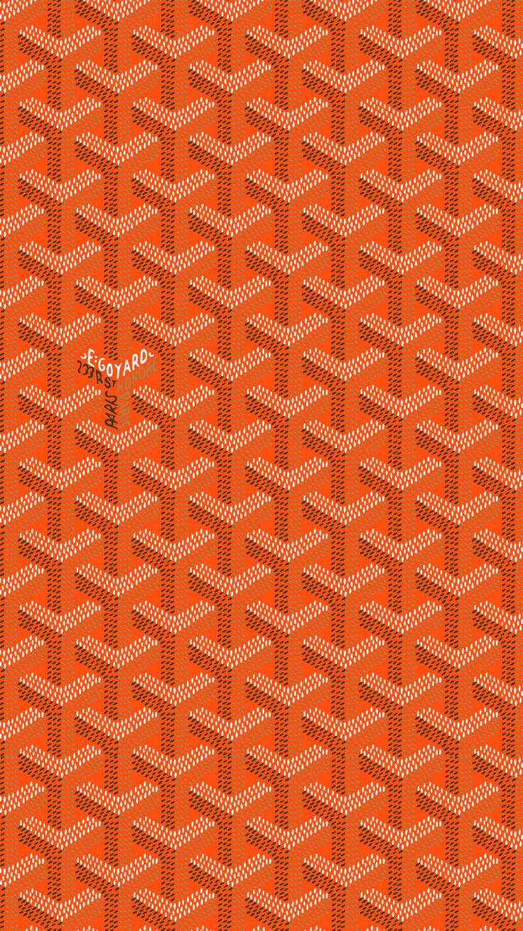 an orange and black pattern with white dots on the bottom, in front of a red background