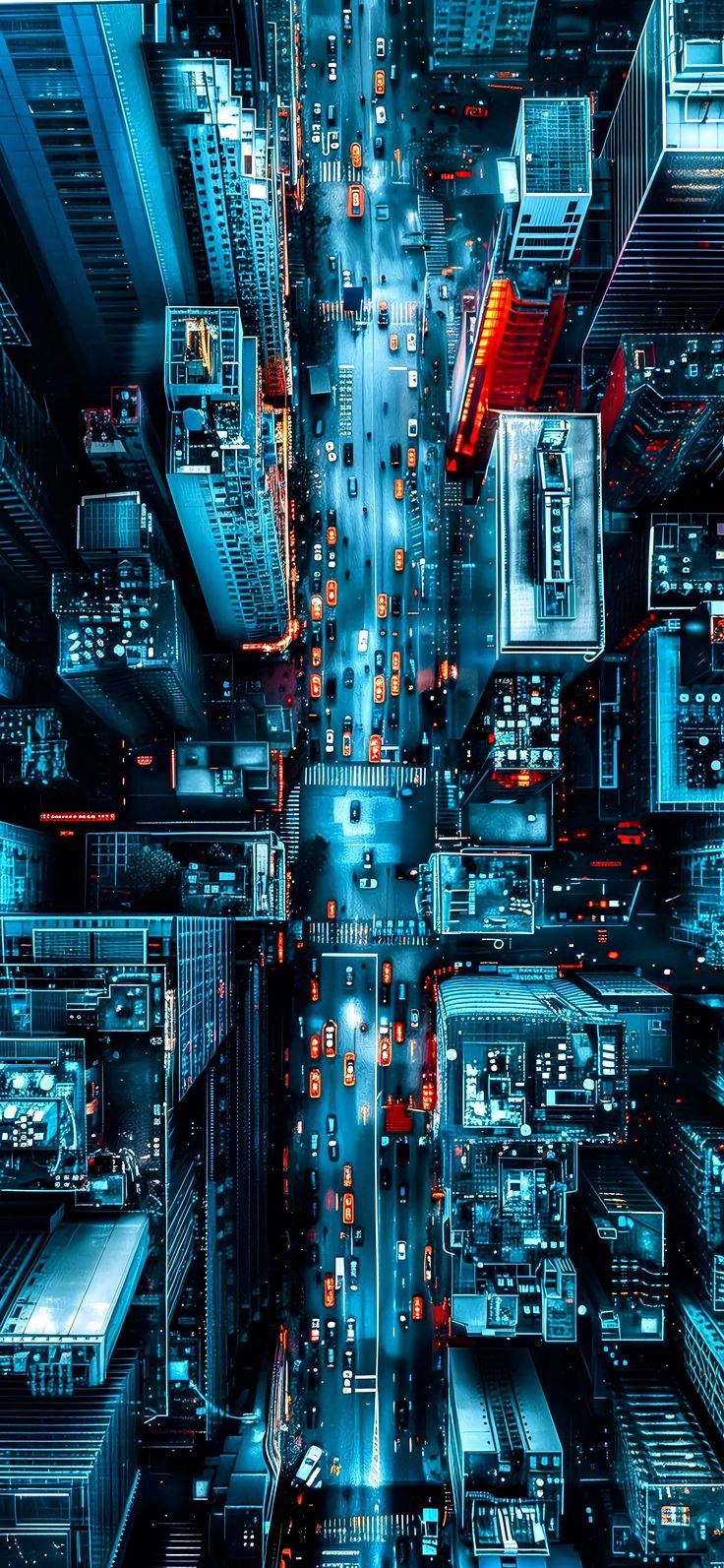 an aerial view of a city at night with traffic lights and skyscrapers in the background