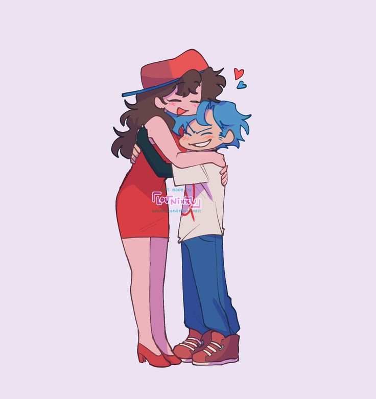 two people hugging each other while one person is wearing a red hat and blue pants