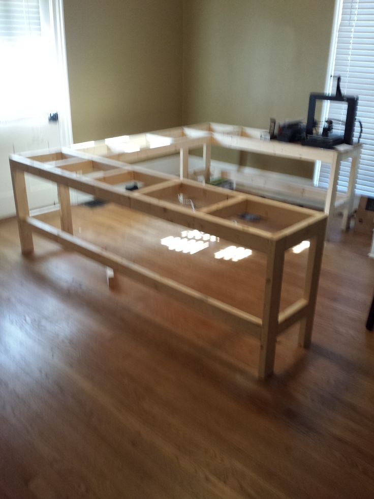 a wooden table sitting on top of a hard wood floor