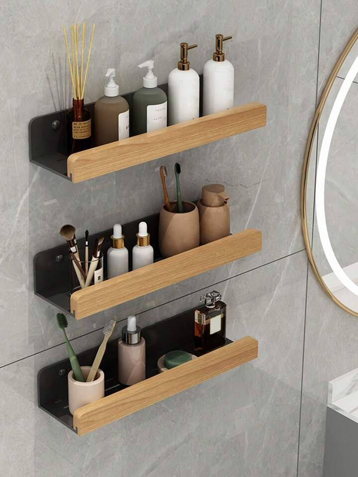 two wooden shelves with soap, toothbrushes and other bathroom items