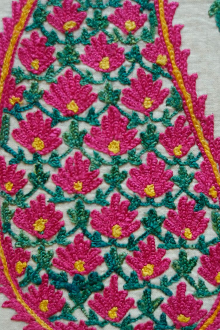 This is an antique Surat area embroidery from Gujarat, Indian in sumptuous green and pink dyed silk. The pink silk is cochineal and the green is from a combination of indigo and a yellow bearing plant. The design is in a beautiful boteh design filled with small flowers and framed by long serrated leaves forming a column between each boteh. It was probably made as a shawl with the boteh, or paisley, designs being on the end of the shawl or a hanging in and of itself with two pieces joined togethe Embroidered Pink Raw Silk Traditional Wear, Embroidered Pink Traditional Wear For Festivals, Pink Embroidered Raw Silk Traditional Wear, Bohemian Pink Embroidered Traditional Wear, Pink Bohemian Embroidered Traditional Wear, Pink Embroidered Festival Traditional Wear, Bohemian Style Pink Traditional Wear For Festivals, Pink Bohemian Traditional Wear For Festival, Pink Embroidered Tussar Silk Traditional Wear