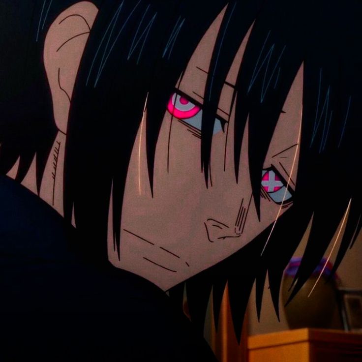 an anime character with black hair and red eyes looking at something in front of him