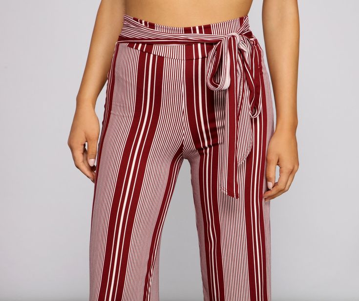 Elevate your summer style with these sassy striped wide-leg pants! They feature a high-rise waist. a tie-front detail. and wide pant legs with a relaxed fit. Complete the look with a basic crop top and clear heels.Fit & Features High-rise waist Tie-front Wide pant legs Relaxed fit Knit fabric. striped print Runs true to size Trendy High-waisted Pants With Tie Waist, Chic High Waist Wide Leg Pants With Vertical Stripes, Chic Striped High-waisted Wide Leg Pants, Chic High Waist Vertical Stripes Wide Leg Pants, Chic Striped High Waist Wide Leg Pants, Trendy Striped Wide-leg Pants, Summer High Waist Wide Leg Pants With Vertical Stripes, Chic Wide Leg Pants With Vertical Stripes For Summer, Trendy Tie Waist Bottoms For Day Out