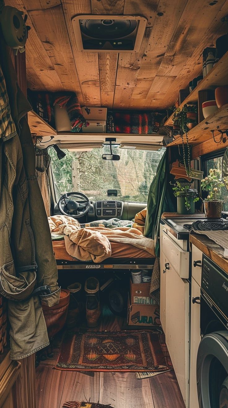 the interior of an old camper van with wood flooring and wooden ceiling beams