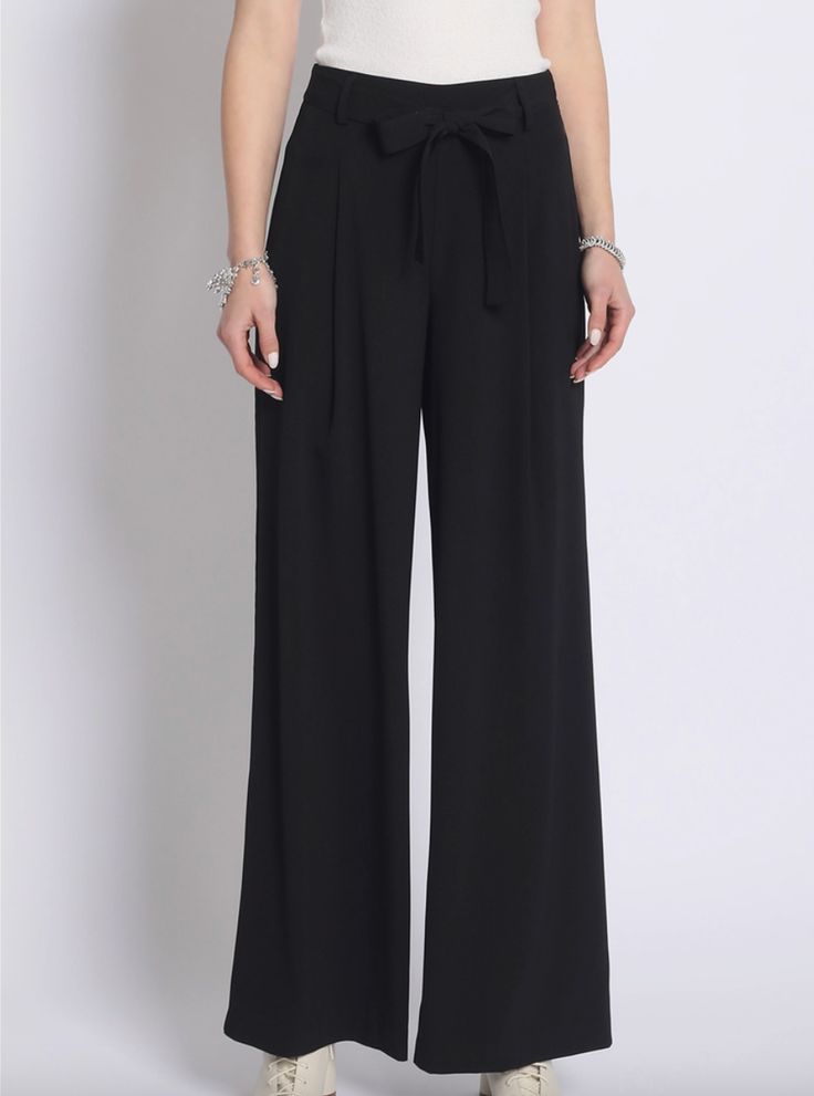 Super chic black wide leg pants with tie waist detail. Excellent quality material. Runs true to size. Model is wearing size small. Bow Pants, Black Wide Leg Pants, Leg Pants, Wide Leg Pants, Pajama Pants, Wide Leg, Perfect Fit, Pants, How To Wear