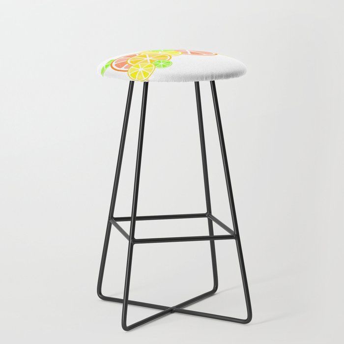 a stool with a flowered seat pad on it and a black metal frame, in front of a white background