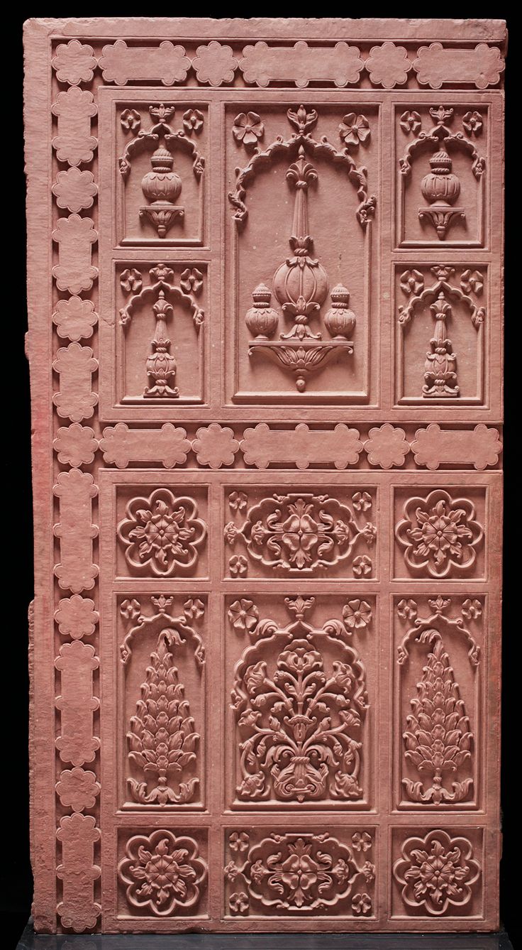 an intricately carved wall panel with decorative designs