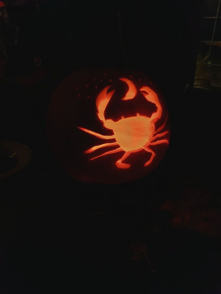 a pumpkin carved to look like a crab