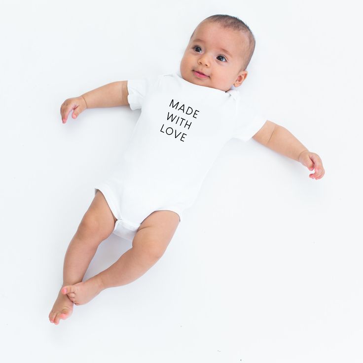 'Made with Love' onesie. For when your little one is crafted together with sugar, spice, and everything nice. 100% organic cotton, printed with baby-safe ink in our studio in sunny Sacramento. Available in infant and toddler tees here. Playful Cotton Bodysuit As A Gift, Personalized Cotton Onesie For Playtime, Personalized Cotton Playtime Onesie, Personalized Cotton Onesie, Personalized Unisex Cotton Onesie, Sugar Spice And Everything Nice, Social Butterfly, Shop Icon, Baby Safe