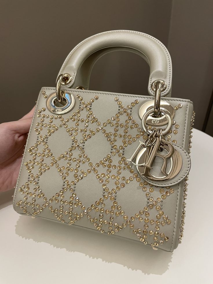 Dior Embellished Lady DiorGold Lambskin LGHWMini 15 x 17 x 7 cmStrap drop 48 cm9.8-9.9/10 Like NewIncludes box, dust bag and bookletPrice now 4900 sgd  3620 usd CN5694-01 Gold Dior Bag, Lady Dior Bag Outfit, Miss Dior Bag, Dior Outfit, Bags Brands, Luxury Fashion Brands, Lady Dior Handbag, Dior Gold, Luxury Bags Collection