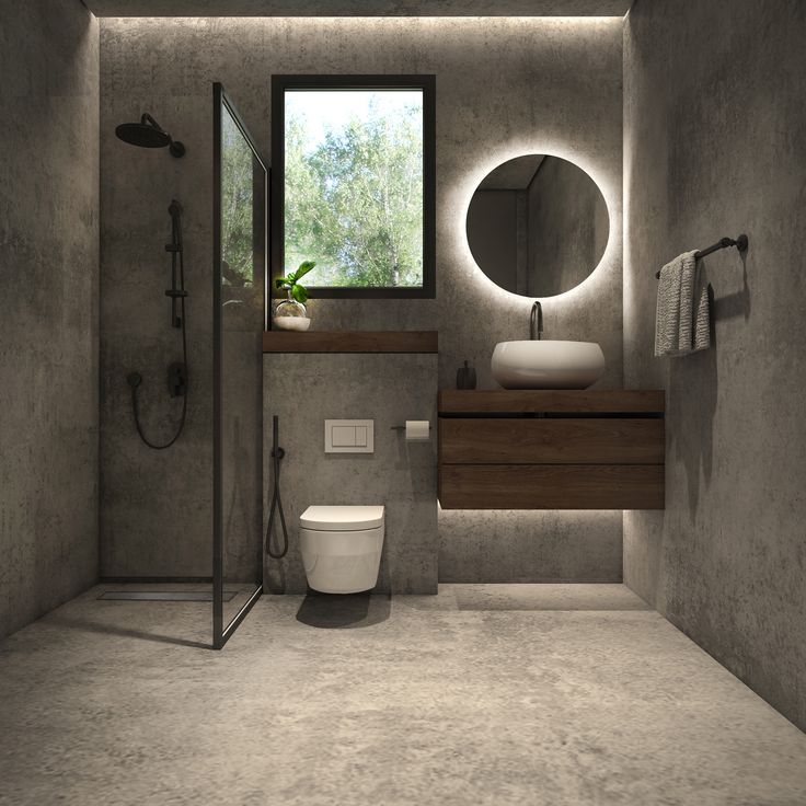 a bathroom with a sink, toilet and shower in the corner next to a window