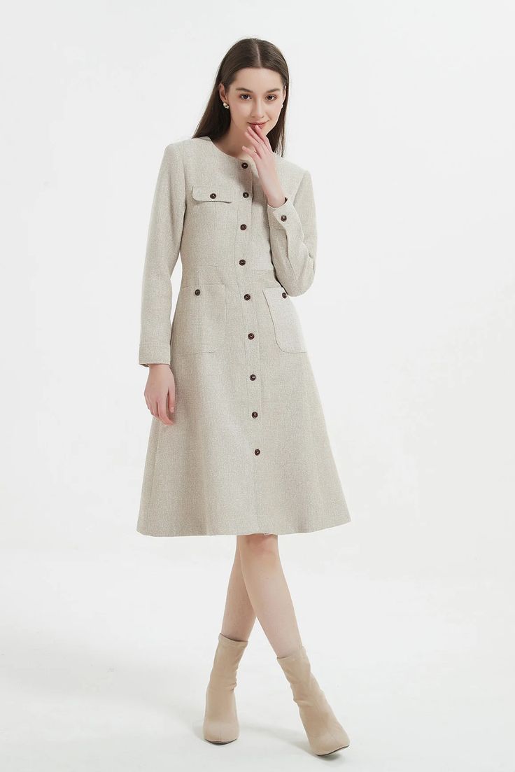 Capturing the epitome of refinement and grace, our elegantly designed Emilia dress is tailored from the finest tweed fabric, exuding a sense of opulence and luxury. Modern asymmetrical design Sculpted A-line silhouette Functional pockets Ultra premium Japanese man-made fabric Luxuriously soft, cozy and wrinkle-resistan Chic A-line Tweed Dress For Work, Elegant Spring A-line Tweed Dress, Fitted A-line Tweed Dress For Formal Occasions, Elegant A-line Tweed Dress For Formal Occasions, Elegant Formal A-line Tweed Dress, Classic Beige Midi Dress For Fall, Formal Fall Tweed Dress With Buttons, Fall Formal Tweed Dress With Buttons, Elegant Fitted Tweed Dress For Fall