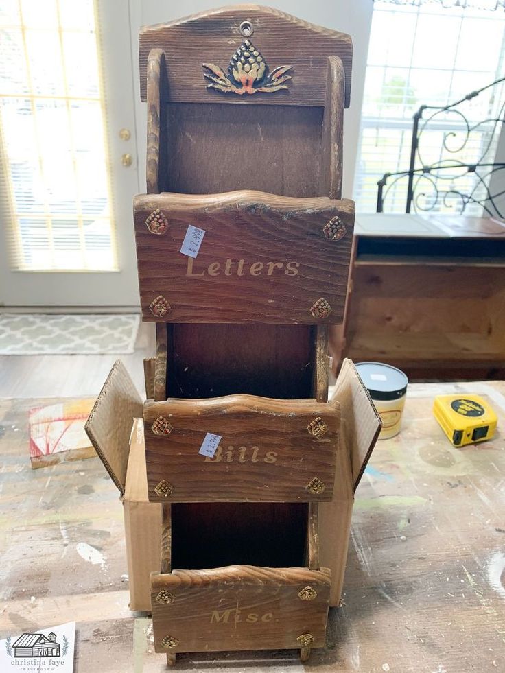 three wooden letters are stacked on top of each other