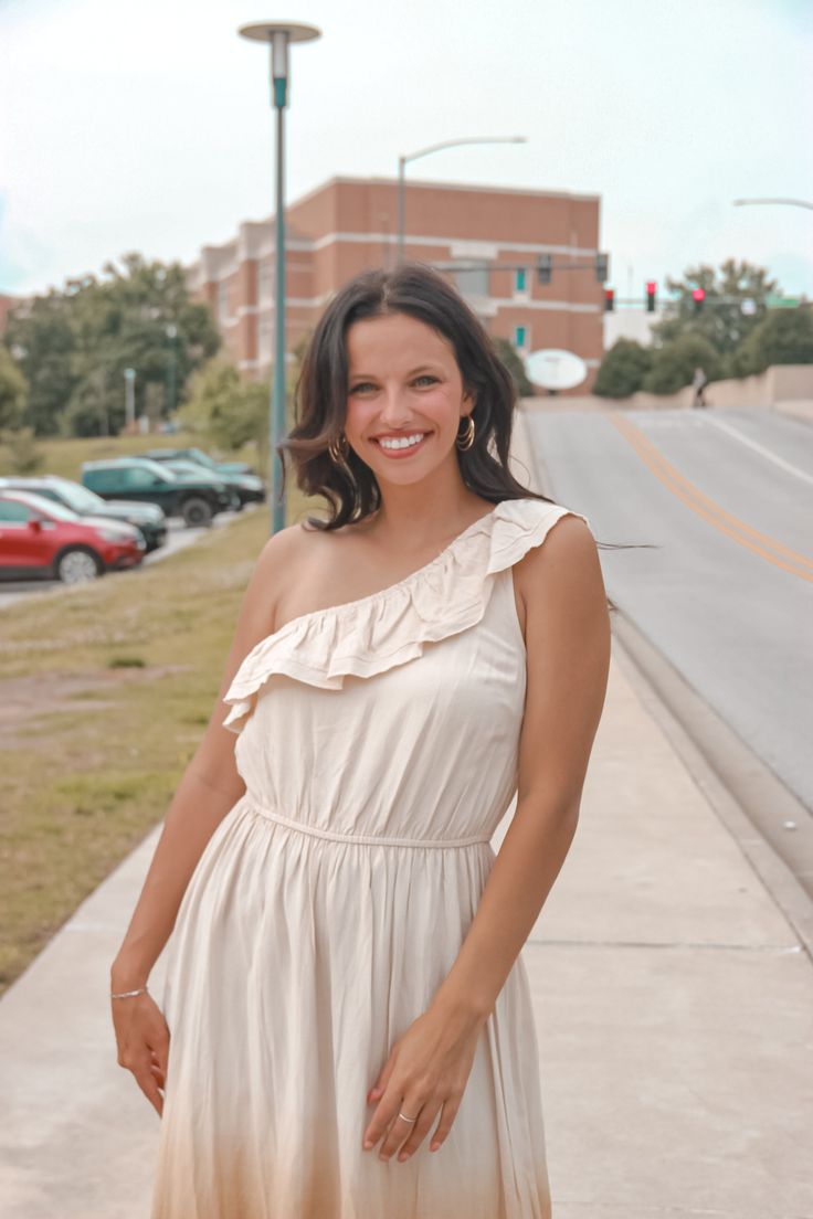 It's all Ombre Skies with this one shoulder ruffle top dress. Fall in love with this maxi length one shoulder dress with an ombre from beige to a dark olive green. We love the elastic band and ruffle top hem detail and we can't forget to mention that bottom hem line that makes you look ten feet tall! Kenzie is 5'6 and is wearing a size small. Feminine One Shoulder Mini Dress For Summer, One Shoulder Feminine Maxi Dress For Summer, Feminine One Shoulder Summer Dress For Brunch, Spring One Shoulder Dress With Ruffle Hem, Feminine One Shoulder Dress For Summer Brunch, Summer One-shoulder Maxi Dress With Ruffles, Feminine One-shoulder Dress For Summer Brunch, Feminine One-shoulder Summer Dress For Brunch, One Shoulder Ruffle Summer Maxi Dress